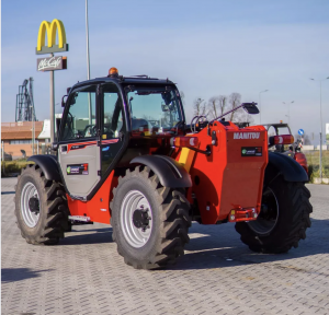 Русский Телескопический погрузчик Manitou MT933